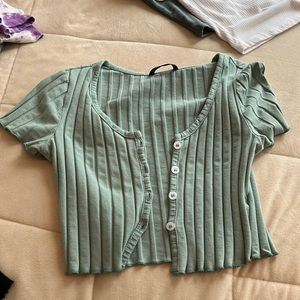 Green button up shirt